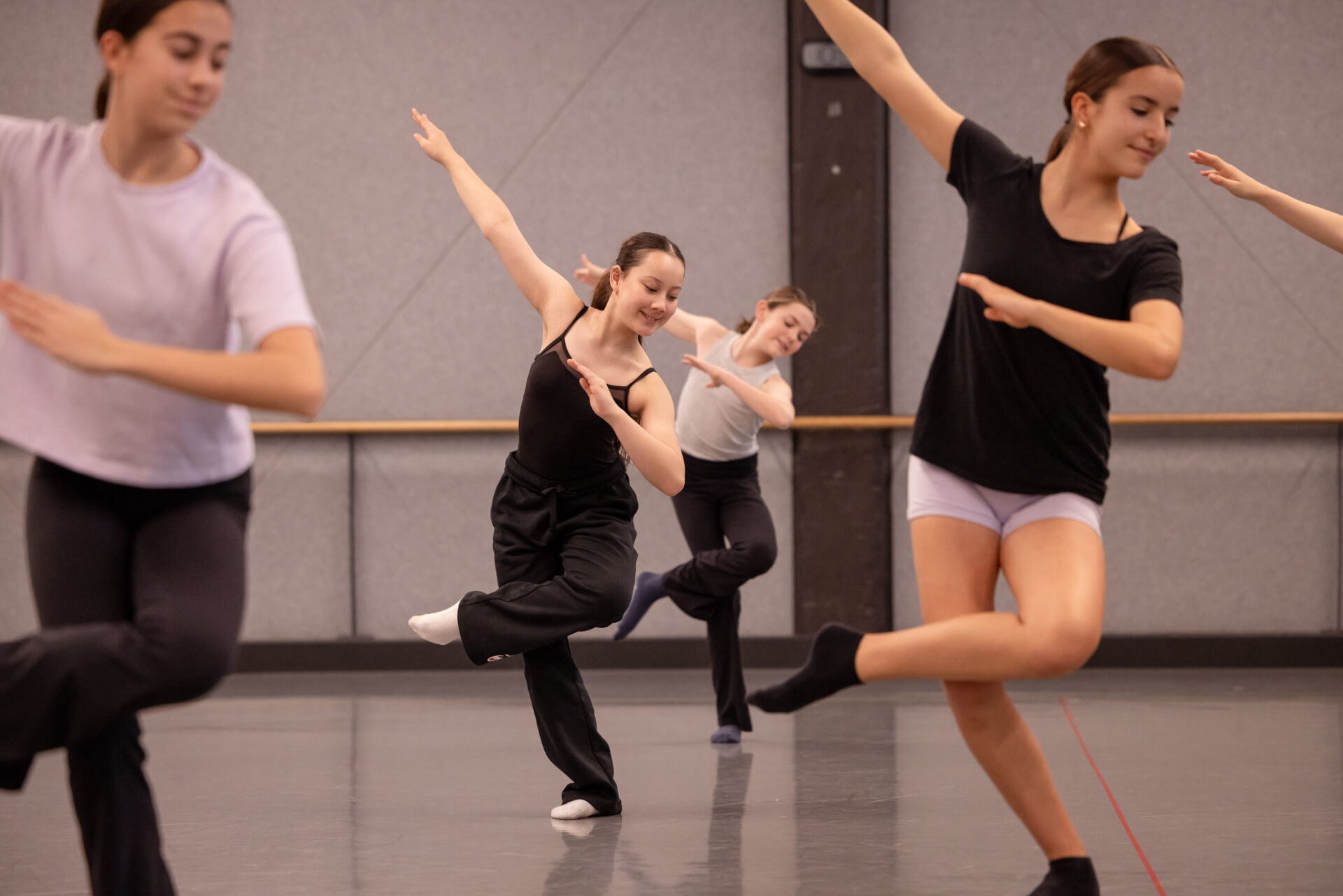 Junior Youth Ensemble dancers taking contemporary class at Sydney Dance Company studios.