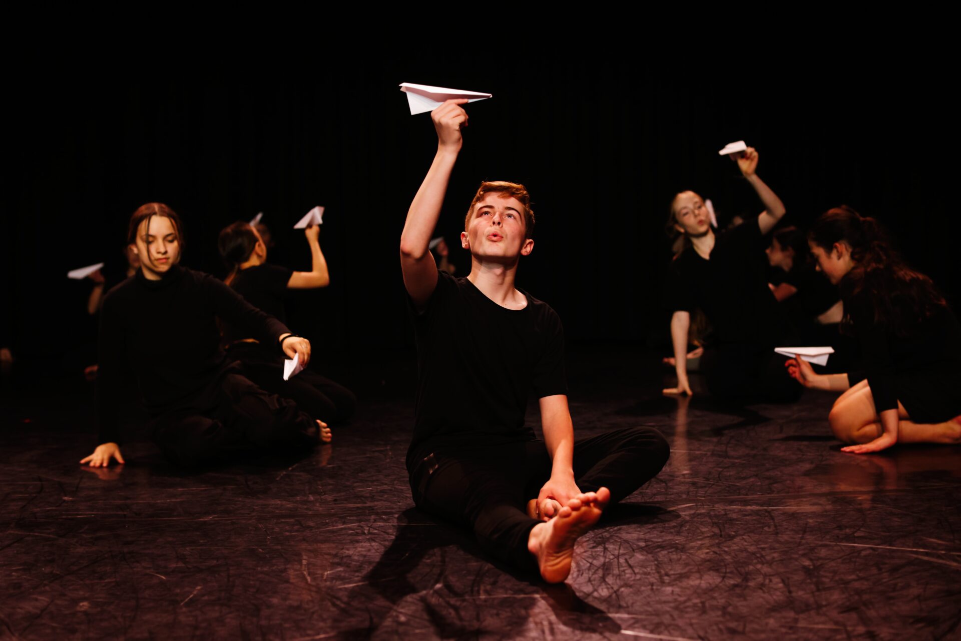 Junior Youth Ensemble dancer onstage at Sydney Dance Company's Neilson Studio.
