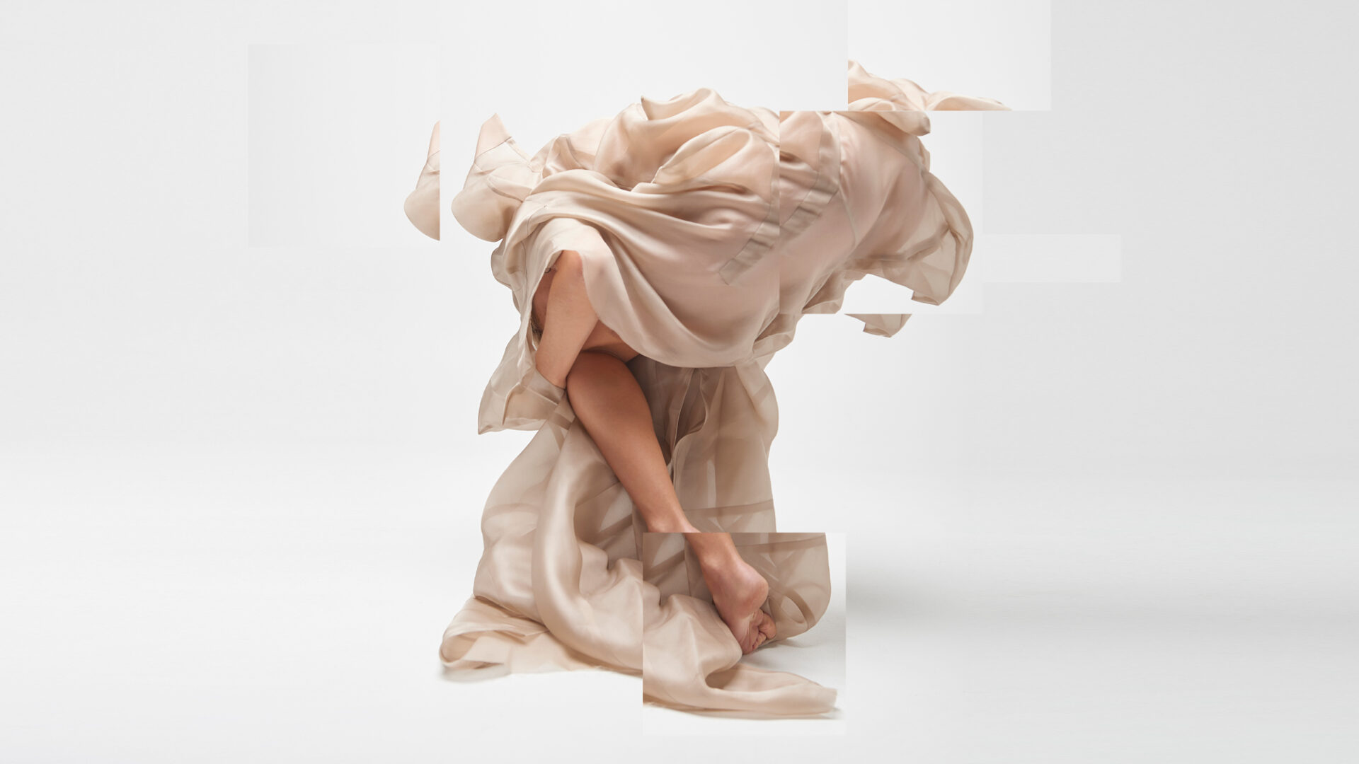 Tessellated abstract image of material draped over a leg. Independent dance program at Sydney Dance Company.